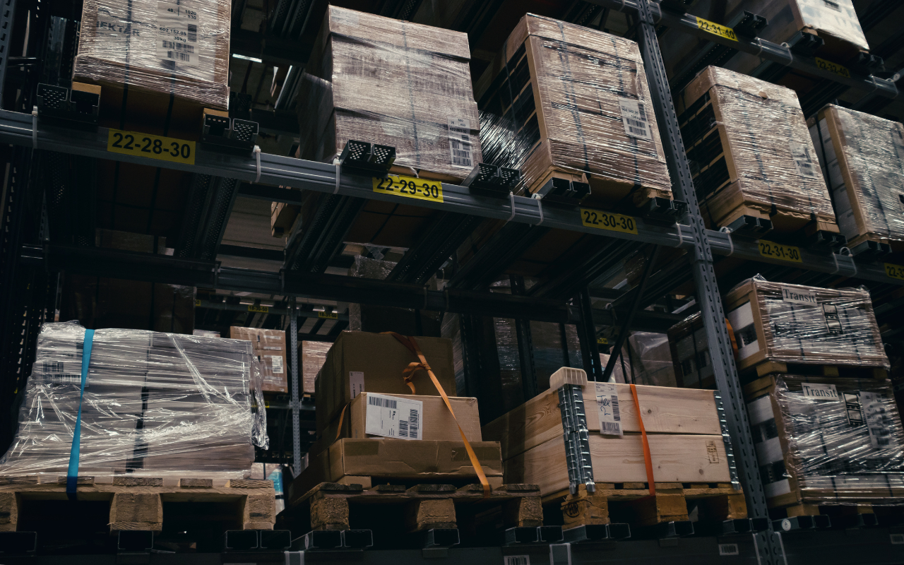 Truck being loaded with goods at a logistics facility