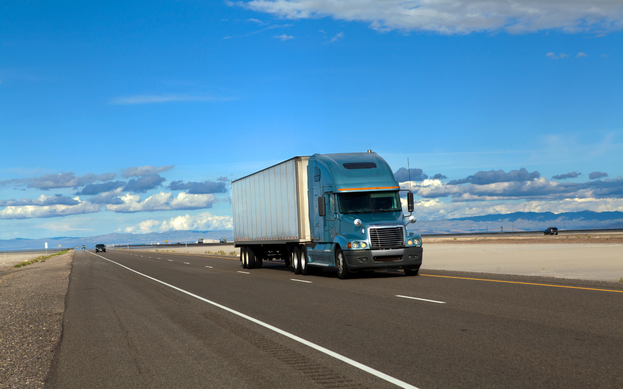 Local freight trucks on the highway transporting goods